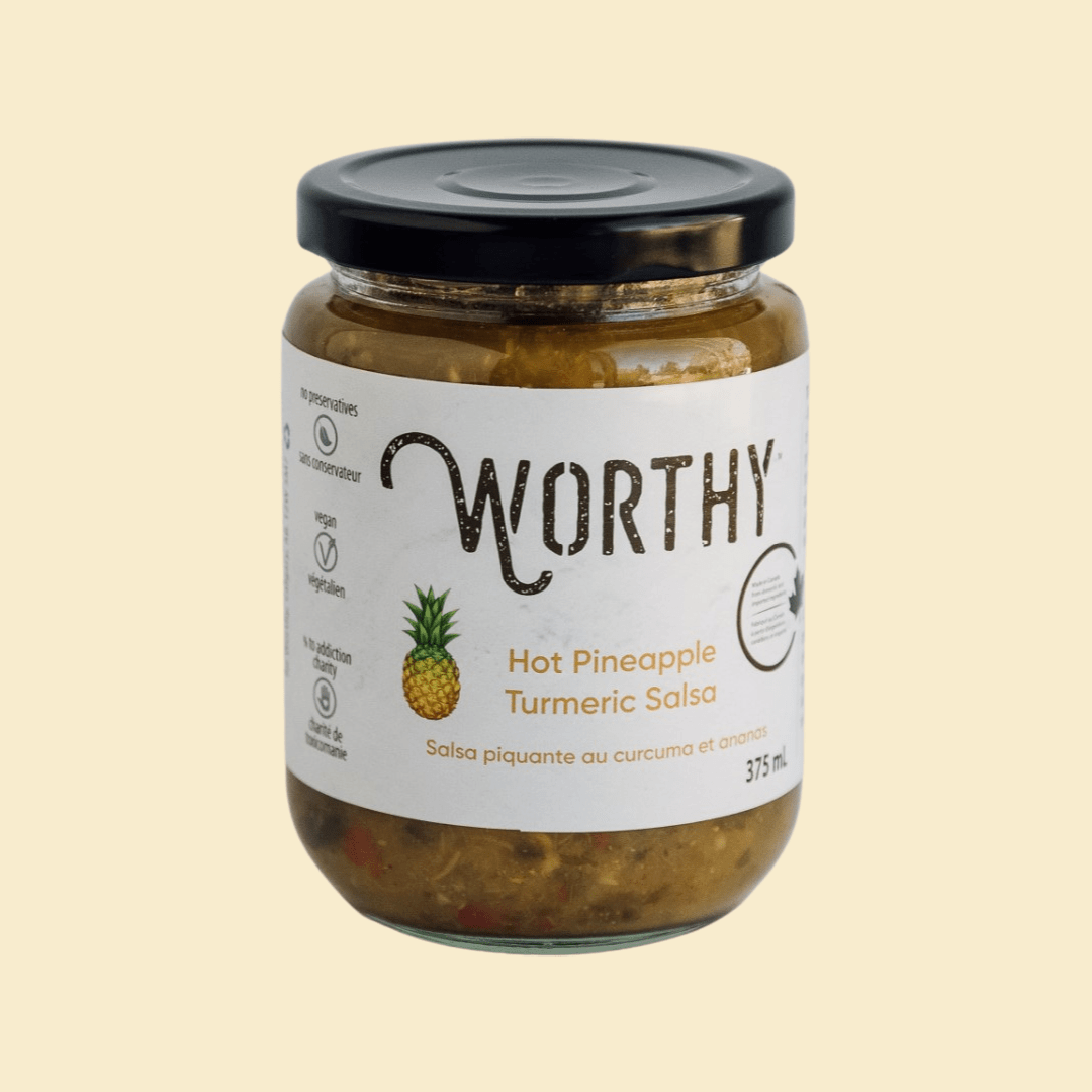 Worthy's Hot Pineapple Turmeric Salsa on a cream coloured background.